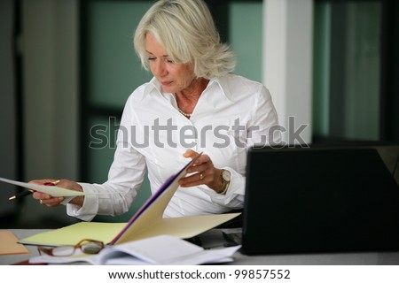 Woman looking through some files