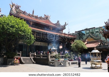 TAIPEI, TAIWAN - APRIL 15, 2015: LongShan Temple at Taiwan on April 15, 2015. LongShan is a famous sacred temple at Taipei, Taiwan for local people and tourist.