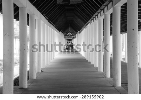 BANGKOK, THAILAND - JUN 15, 2015 : Black and White effect, Hallway in the university at Bangkok, Thailand on Jun 15, 2015. The security officers are on duty to patrol and guard for student safety.