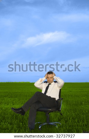 Depress young businessman sitting in the chair