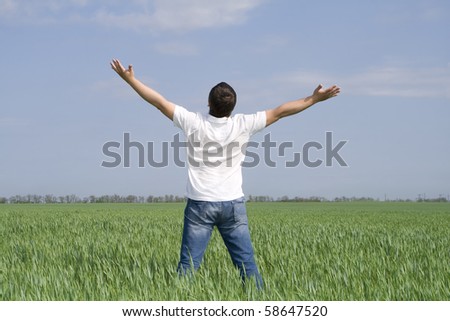 man take energy from nature in the meadow - stock photo
