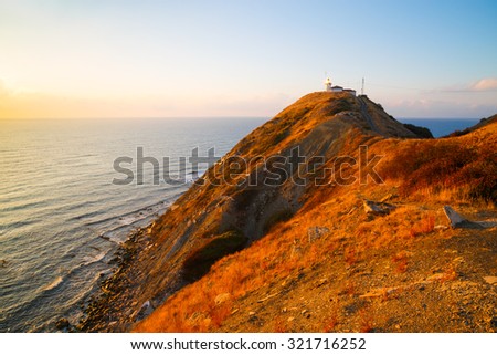 The lighthouse at Cape Emine at sunrise, Black sea coast, Bulgaria. Cape Emine forms the tip of Balkan Mountains. Cape Emine is said to be Bulgaria\'s stormiest cape.