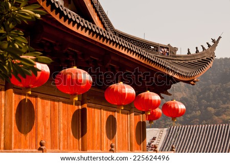 Red lanterns hanging on the temple roof/ Chinese lanterns in a chinese temple