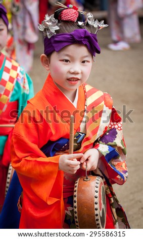 KYOTO, JAPAN - JULY 7: little Japanese girl in geisha makeup and a kimono at Shiramine Jingu shrine during Tanabata Festival celebrations in Kyoto on July 7th 2015.