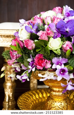 close-up of fresh flowers,  beautiful romantic bouquet for Valentine\'s Day. Holidays and  marriage celebrations decorate in golden vase
