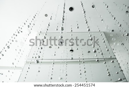 variety shapes of  reflective metal balls on white background, selective focus