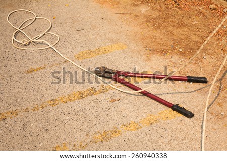 wire stripper or wire cutter isolated on concrete background