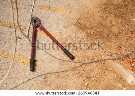 wire stripper or wire cutter isolated on concrete background