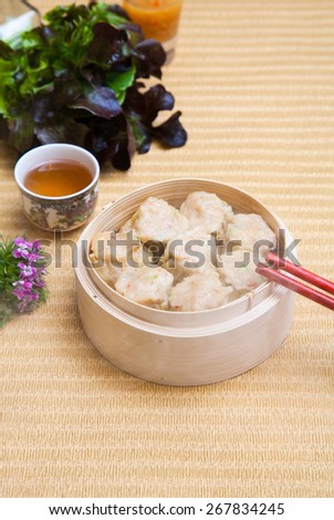 assortment dimsum / Chinese Steamed shrimp dumplings dimsum in bamboo containers traditional cuisine.