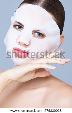 Beauty portrait with a mask sheet