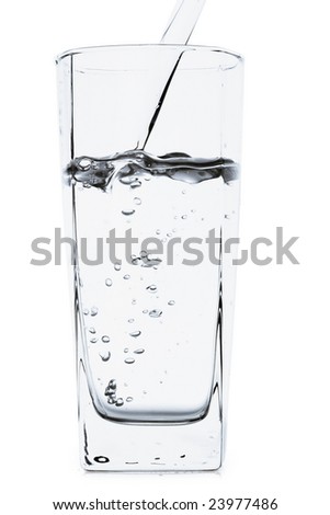 Glass of pouring water isolated on white