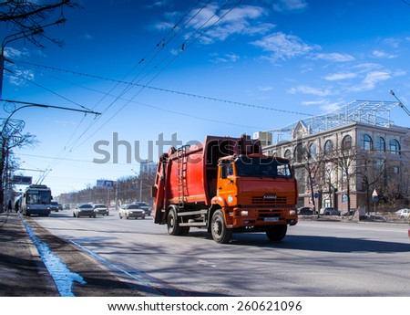 UFA/BASHKORTOSTAN - RUSSIA 13th March 2015 - A red powerful Kamaz industrial vehicle moves along an urban street