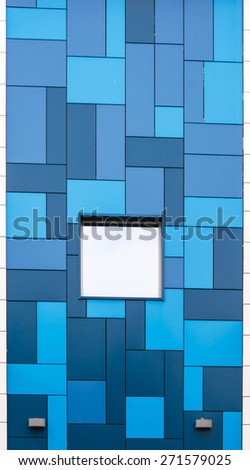 Modern style blue and white building with reflective glass windows