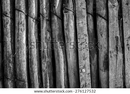 Planks of old timber joined together to make a rustic fence