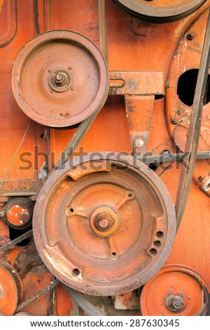 Close-up of rusty cogs and gears of a disused USSR Soviet combine harvester