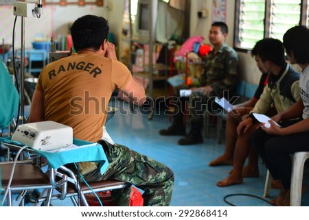 CHIANG RAI, THAILAND -APRIL 5 2015: Unidentified dentist volunteer from public hospital are in medical services at Ban La Ba school  on April 5,2015 in Chiang rai,Thailand.