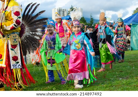 WEST VANCOUVER, BC, CANADA - AUGUST 30 : First Nation Royal Kids take part in Grand Entry of the Squamish Nation 27th Annual Pow Wow in West Vancouver, Canada on August 30 2014