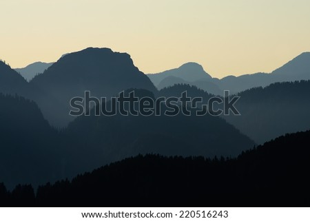 Layered Mountains Silhouette on Sunset