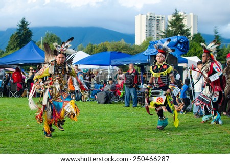 WEST VANCOUVER, BC, CANADA - AUGUST 30 : Unidentified First Nation men take part in Grand Entry of the Squamish Nation 27th Annual Pow Wow in West Vancouver, Canada on August 30 2014