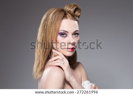 Makeup girl with curved hair and half red lips