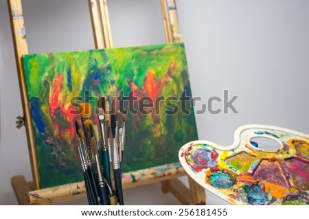 School painting supplies brushes easel and palette for learning