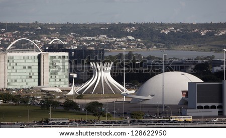 Brasilia, Brazil - February 21: Cathedral Of Brasilia And National Museum On February 21, 2009 In Brasilia, Brazil.They Were Designed By Oscar Niemeyer,One Of The Greatest Architect In Modern History.