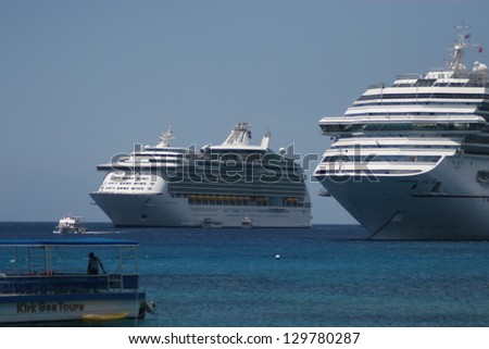 GEORGE TOWN, CAYMAN ISLANDS - APRIL 5: Cruise ships anchored at the harbor of Grand Cayman for this popular stop of cruise lines on April 5, 2008 in George Town, Cayman Islands.
