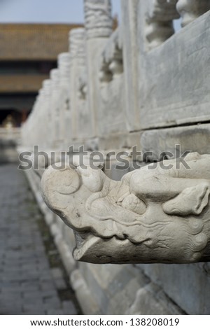 An ornate carved stone wall in the Forbidden City, Beijing, China