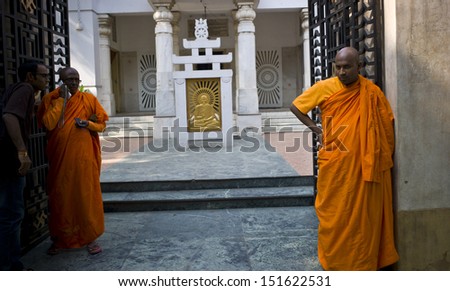 DELHI, INDIA - NOV12:  Buddhist monks stand at the entrance of a temple on November 12, 2012 in Delhi, India. Indian enjoys freedom of religions. Buddhist temple is popular in this country.