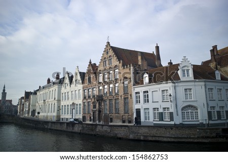 BRUGES, BELGIUM - NOV 30: Houses along the canals of Brugge or Bruges, Belgium on November 20, 2012. Bruges is frequently referred to as \