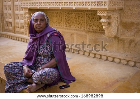 JAISALMER, INDIA - JAN 12: Unidentified Indian woman lives in Jaisalmer Fort in Thar desert on January 12, 2013 in Jaisalmer, India. Jaisalmer Fort is the only livable fort in India.
