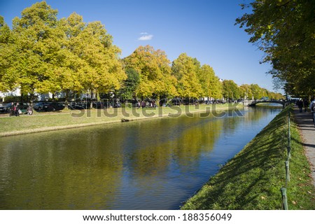 MUNICH, GERMANY - OCT 18: The river at Nymphenburg Palace, the summer residence of the Bavarian kings, in Munich, Germany on October 18, 2013. This palace welcomes 300,000 visitors per year.