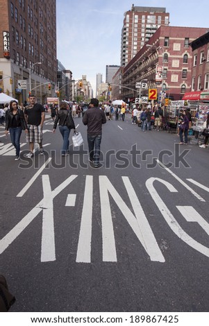 NEW YORK - JUN 28: People walking on the road during Sixth Avenue Festival on Jun 28, 2010 in New York City.