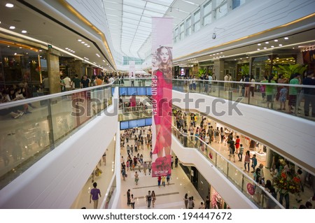 GUANGZHOU, CHINA - MAY 19: People are flocking into a newly opened mall for shopping in Guangzhou, China on May 19 2014.