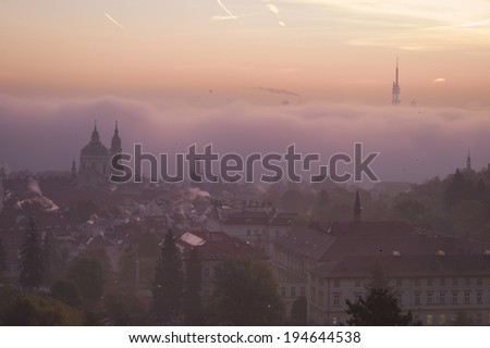 PRAGUE, CZECH REPUBLIC - OCT 22: Old City in the fog at sunrise moment on October 22, 2013 in Prague, Czech Republic. Prague received 5.1 million visitors in 2012: Europe\'s 5th most visited city.