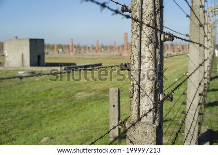 AUSCHWITZ, POLAND - OCT 29: The fence and the houses of the infamous Auschwitz II-Birkenau, a former Nazi extermination camp and now a museum on October 29, 2013 in Oswiecim, Poland
