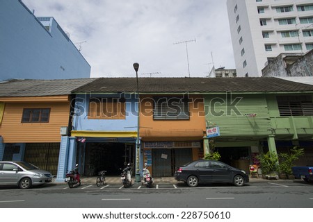 HAT YAI, THAILAND - OCT 4: Old historic houses, which are painted in colors, on the old street in Hat Yai, Thailand - October 4, 2014. The culture of this city is mainly influenced by Malay.