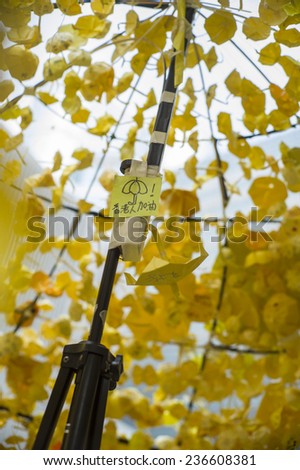 HONG KONG - OCT 15: People hang up the yellow paper umbrealla and make wish during Occupy Central movement in Admiralty in Hong Kong on October 15 2014.