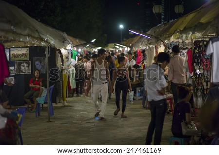 PHNOM PENH, CAMBODIA - NOV 19: People shop in the night market near near Mekong river in capital city Phnom Penh, Cambodia on November 19 2014.