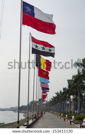PHNOM PENH, CAMBODIA - NOV 17: The flags of all nations are hung on Preah Sisowath Quay in Phnom Penh, Cambodia on November 17 2014.