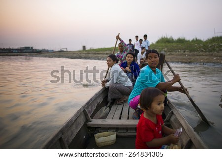 MANDALAY, MYANMAR - MAR 5: People living in a shanty town are crossing a river in Mandalay, Myanmar on the 5 March 2015.