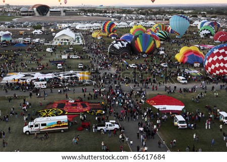 ALBUQUERQUE - OCTOBER 9: Balloons fly over the crowd on October 9, 2010 in Albuquerque, New Mexico. Albuquerque balloon fiesta is the biggest balloon event in the the world.