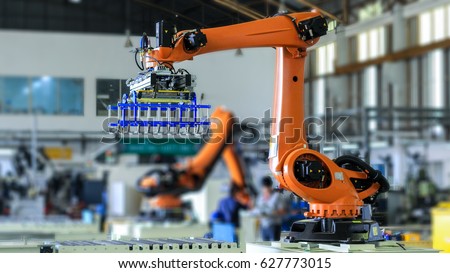 Industrial picking robot in production line manufacturer factory