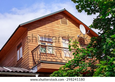Old wooden country house on a sunny summer day in Russian village