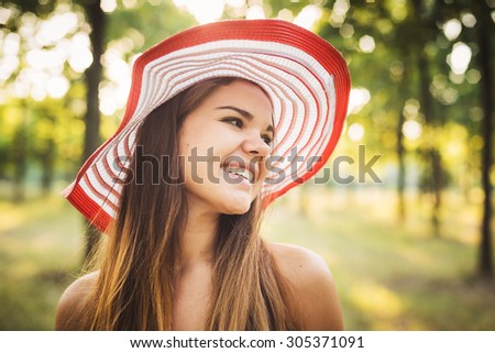 young beautiful caucasian female enjoying the sun in park