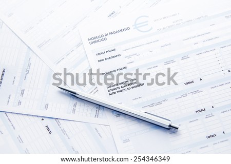 Tax forms: business, economic and financial photo. Italian tax papers in the photo.