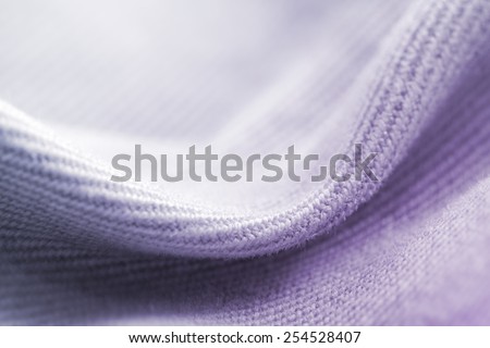 Natural wool clothes and fabrics: textile and fabric macro photo.