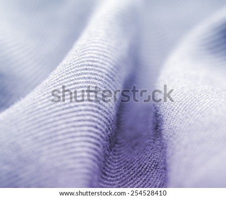 Natural cotton fabric: textile and fabric macro photo.