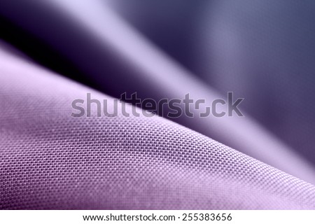 Purple silk. Textile industry and fabric backgrounds.