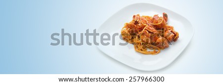 Italian food background: tomato spaghetti plate.
